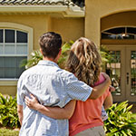 Family looking at house